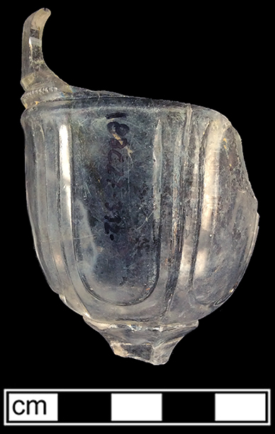 Colorless soda lime glass stemmed glass with panelled motif. Rim diameter: 2.00”. 18BC27